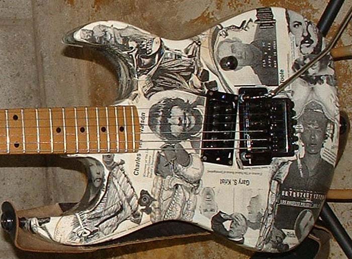 B.C. Rich Gunslinger 6 string electric guitar decoupaged with serial killer and Gray's Anatomy motif. Seymour Duncan Invader Humbucker pickup and Floyd Rose licensed locking tremelo.